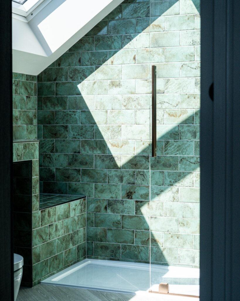 Green tiled shower enclosure